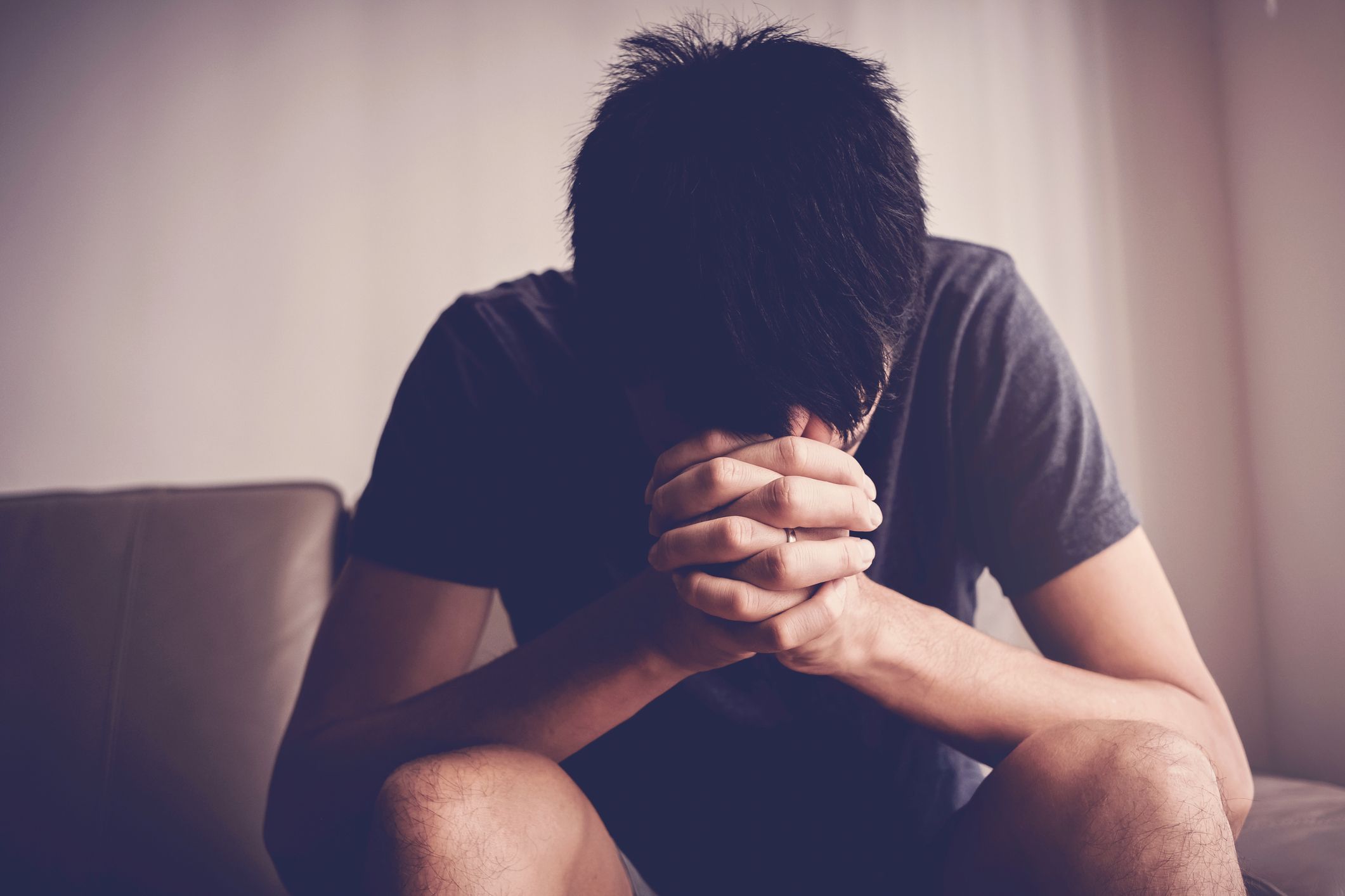 Depressed Despair and Anxiety Young Man Sitting Royalty Free Image 1654508813