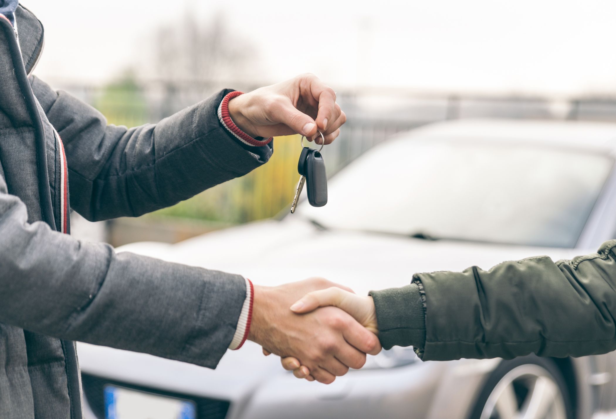 Two People Reaching an Agreement About a Car Sale Royalty Free Image 1665671206